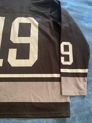 Champion #19 Champion Logo Hockey Jersey Sz L (44) (25in W X 30in L) Black
