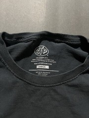 Y2K STP black cotton t-shirt Size L has a kilt stain as shown in last slide