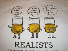 Funny T-Shirt- Realists “The Only Ones Who Really Know What’s Going On” Size L
