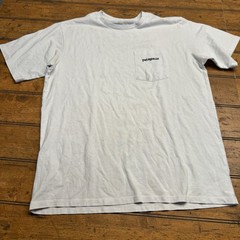 Patagonia T-Shirt with Chest Pocket – Blue – Large Graphic on Back – Men’s Small