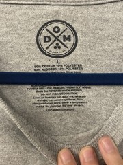 DOM brand graphic tee with the slogan “NOPE – Not gonna happen.”