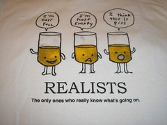 Funny T-Shirt- Realists “The Only Ones Who Really Know What’s Going On” Size L