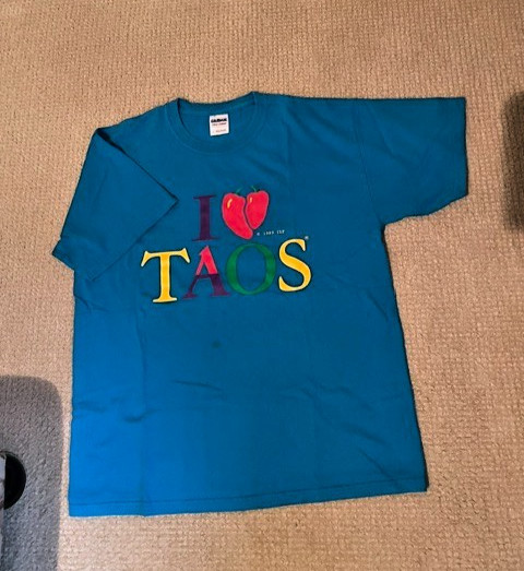 Men’s T shirt size L, new w/o tags never worn “I love TAOS” Turquoise in color