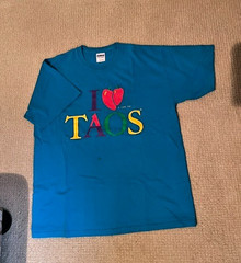 Men’s T shirt size L, new w/o tags never worn “I love TAOS” Turquoise in color