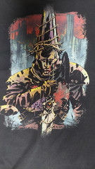 Blasphemous Graphic Tee – Video Games Shirt – Retro