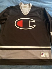 Champion #19 Champion Logo Hockey Jersey Sz L (44) (25in W X 30in L) Black