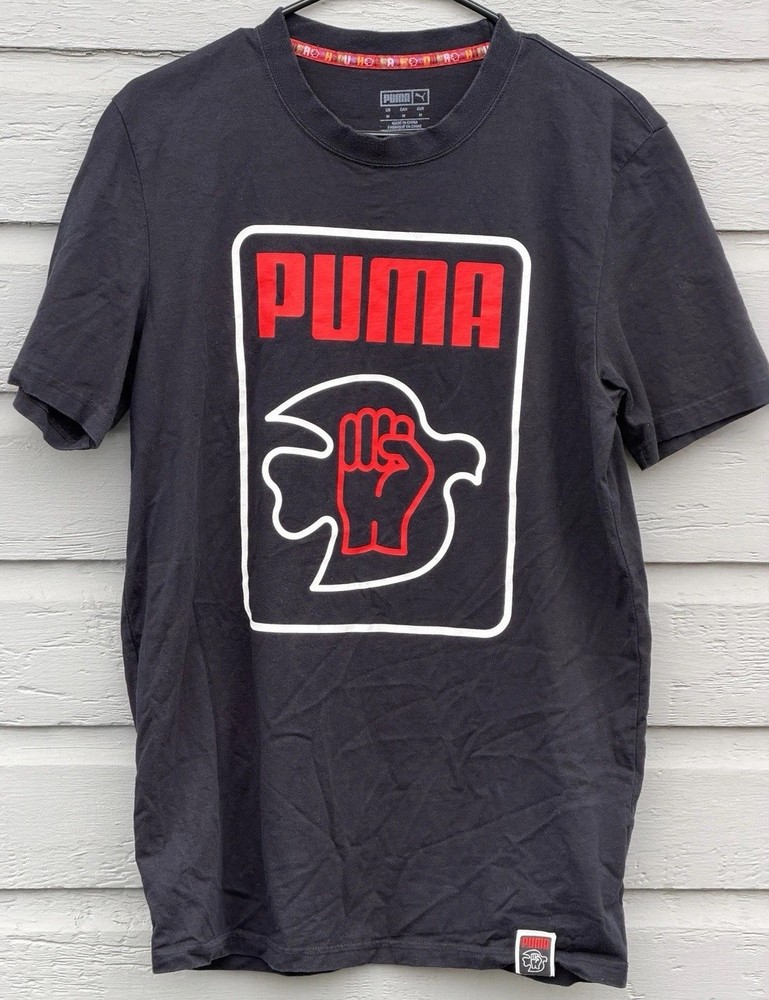 Puma x Lance Wyman Men’s Tee Shirt MEDIUM Power Through Peace Defenition Graphic