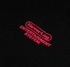Supa Dupa RARE N.E.S. Swag Golf NEVERLAG CARTRIDGES & CONTROLLERS BLACK TEE Lrg