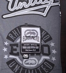 This is a grey Mens Ecko Unltd all-over print t-shirt Size Medium