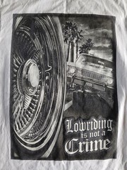 T-Shirt “Lowriding is not a Crime” design printed on a Shaka Wear blank Size L