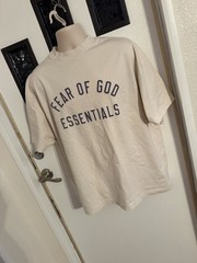 Fear of God Essentials oversized beige/tan graphic T-shirt front arch Logo Clean