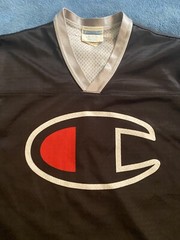 Champion #19 Champion Logo Hockey Jersey Sz L (44) (25in W X 30in L) Black