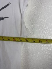 White graphic T-shirt featuring an abstract, hand-drawn fashion